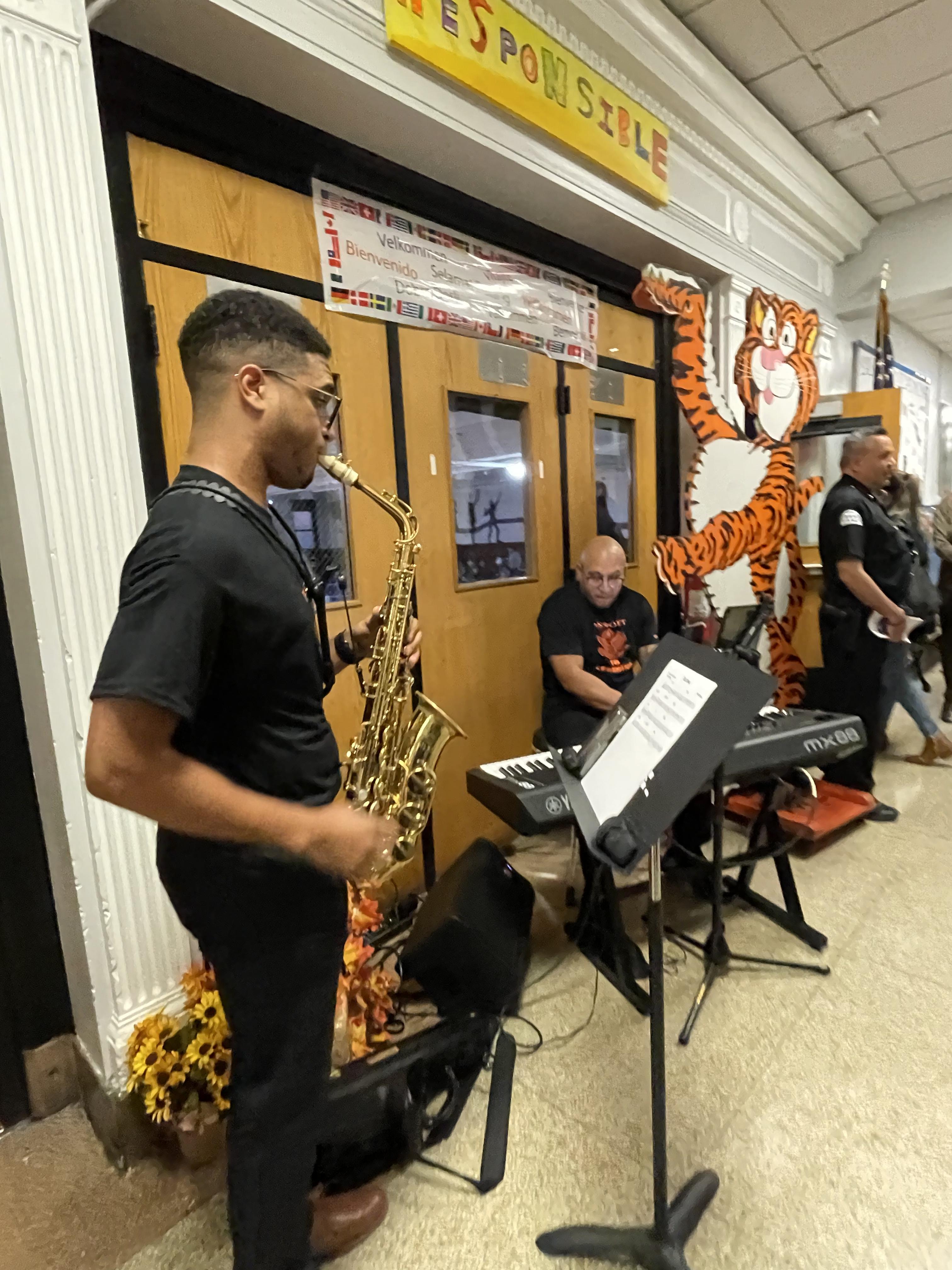 Student playing the saxophone during Back To School Night at the Washington School