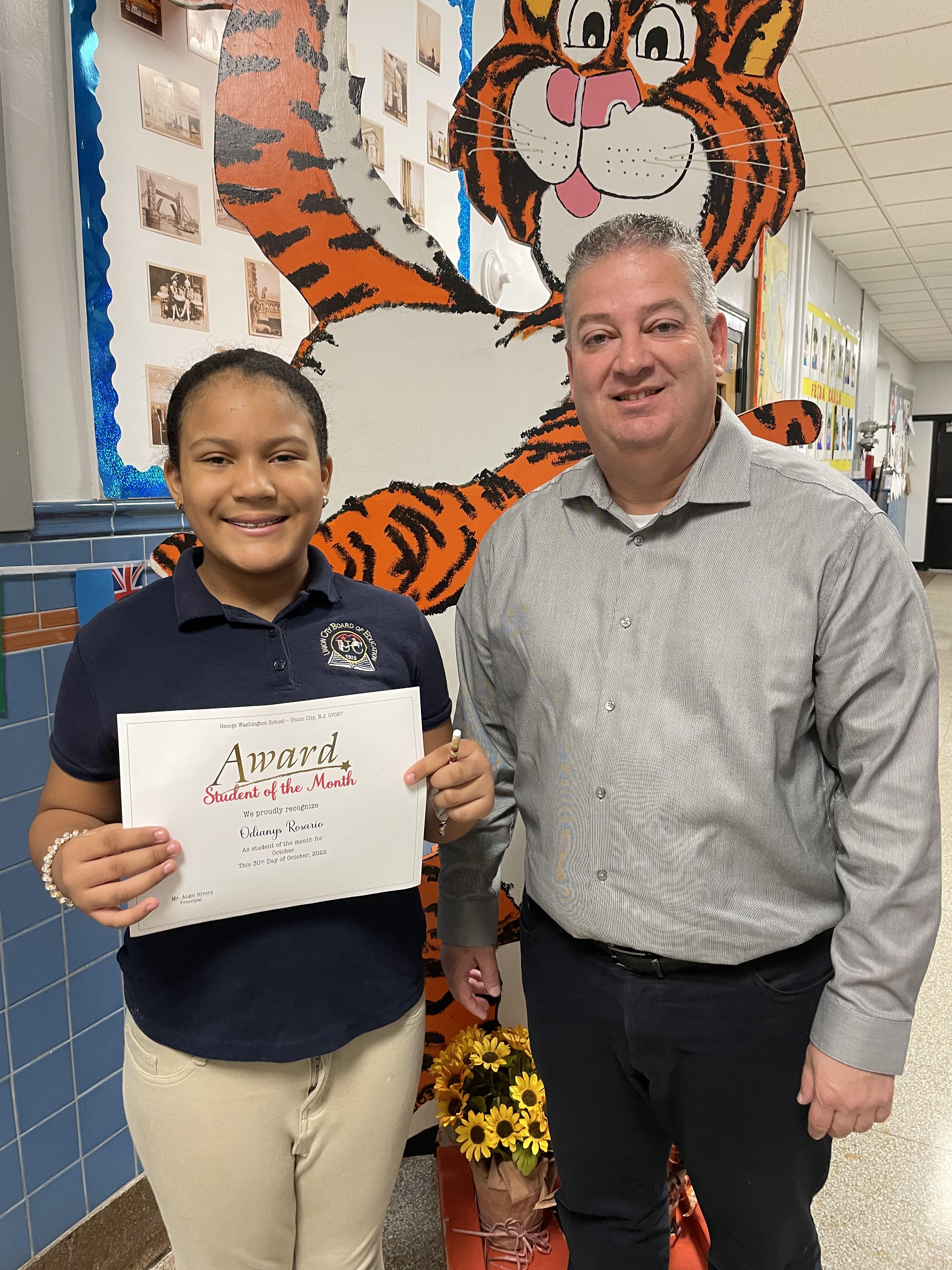 October 2022 Student of The Month with Washington School Principal Angel Rivera